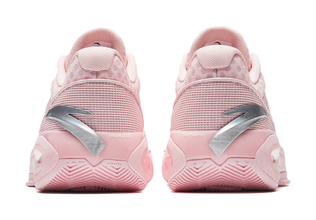 Back view of light pink low-top basketball shoes with heel tabs and panel details