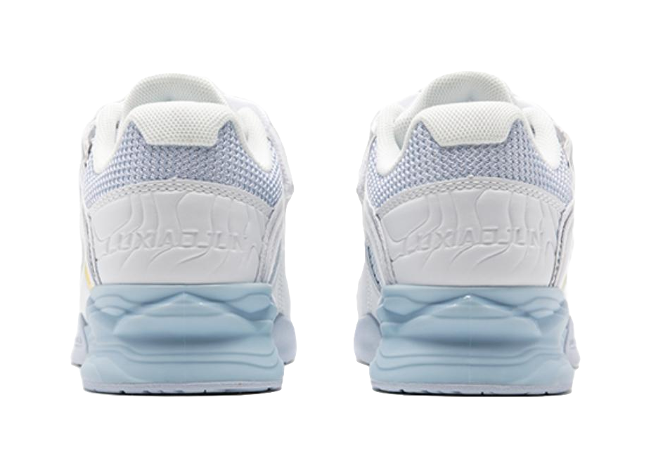 White low-top training shoes, back view with light-blue heel cushioning