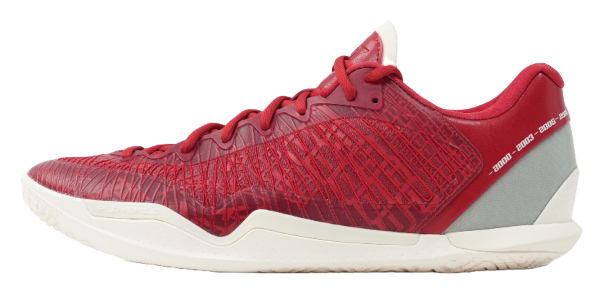 Red basketball shoe with gray side panel, textured upper, and white rubber sole