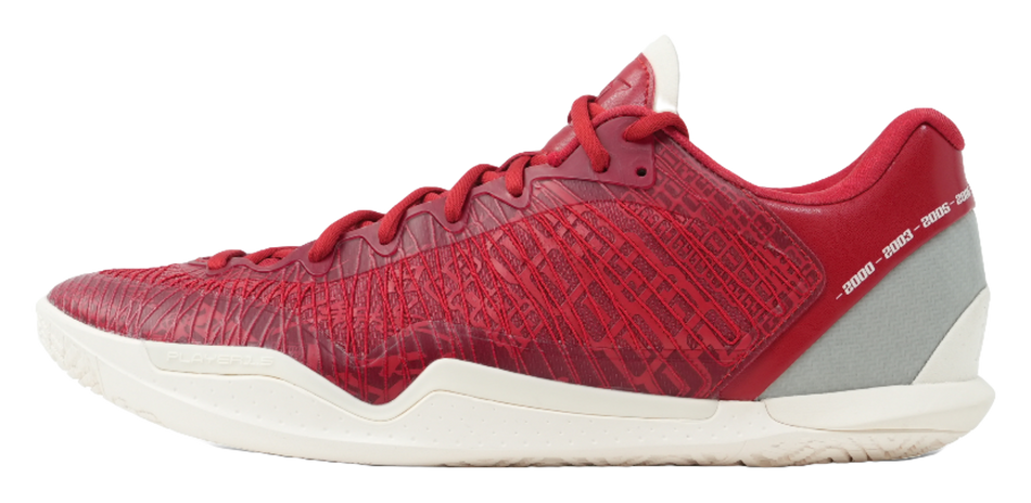Red basketball shoe with gray side panel, textured upper, and white rubber sole