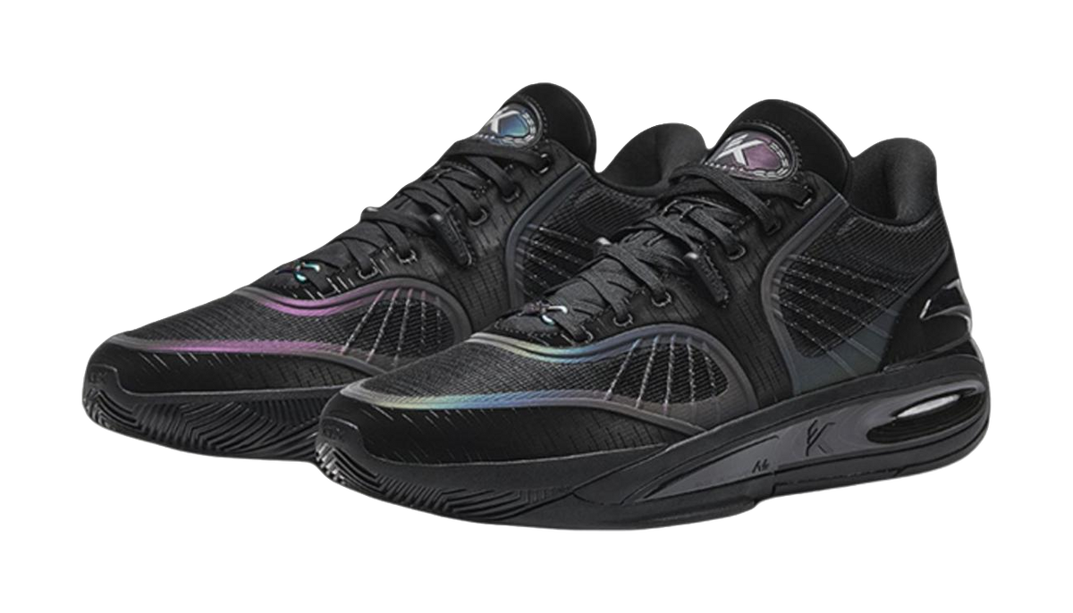 Pair of black basketball shoes with lace-up design, purple accent panels, and air-cushion sole