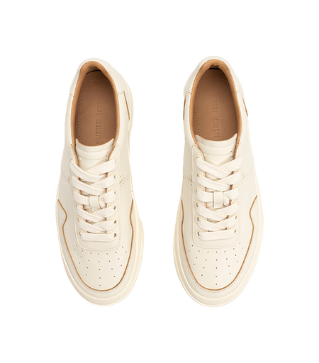 Antique white low-top skate shoes with woven laces and tan interior lining