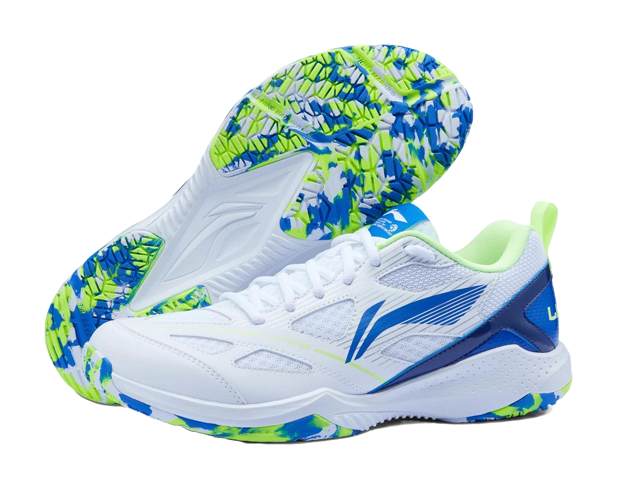 White badminton shoe with blue side stripe and neon green speckled outsole, lace-up