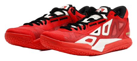 Red low-top basketball shoe with white stripes, black collar, and thick red sole