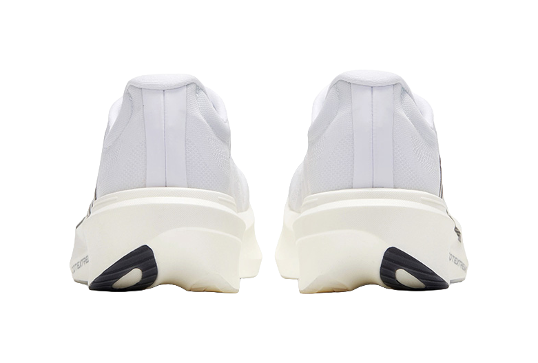 White low running shoe with rear pull tab and black heel accent