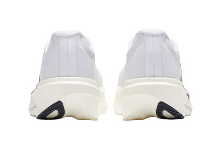 White low running shoe with rear pull tab and black heel accent