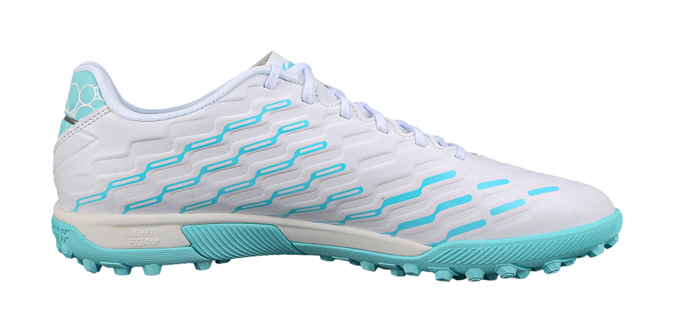 White soccer shoe with turquoise wavy side panels, lace-up vamp, and studded outsole