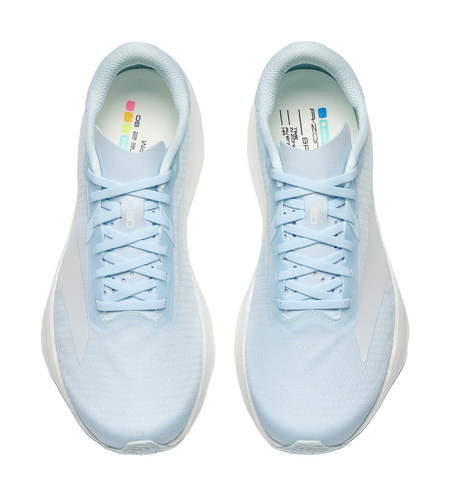 Pair of light blue low-top running shoes with lace-up closure and teal-lined collar
