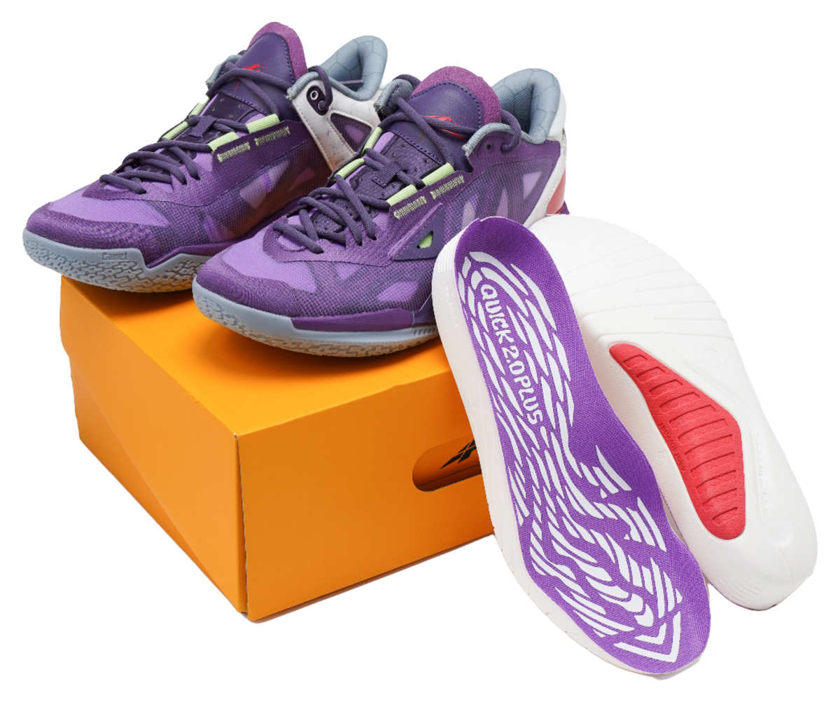 Purple basketball shoes showing off-white insole with white traction graphic and red pad
