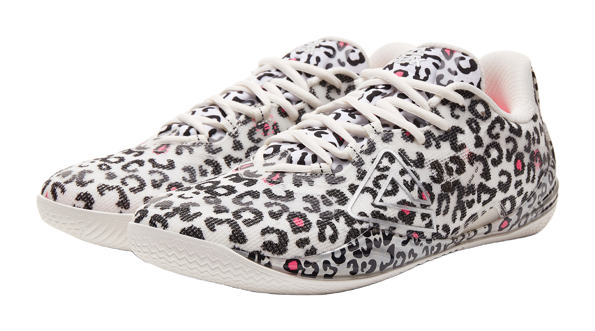 White low-top basketball shoe with leopard print, braided laces, and front logo panel