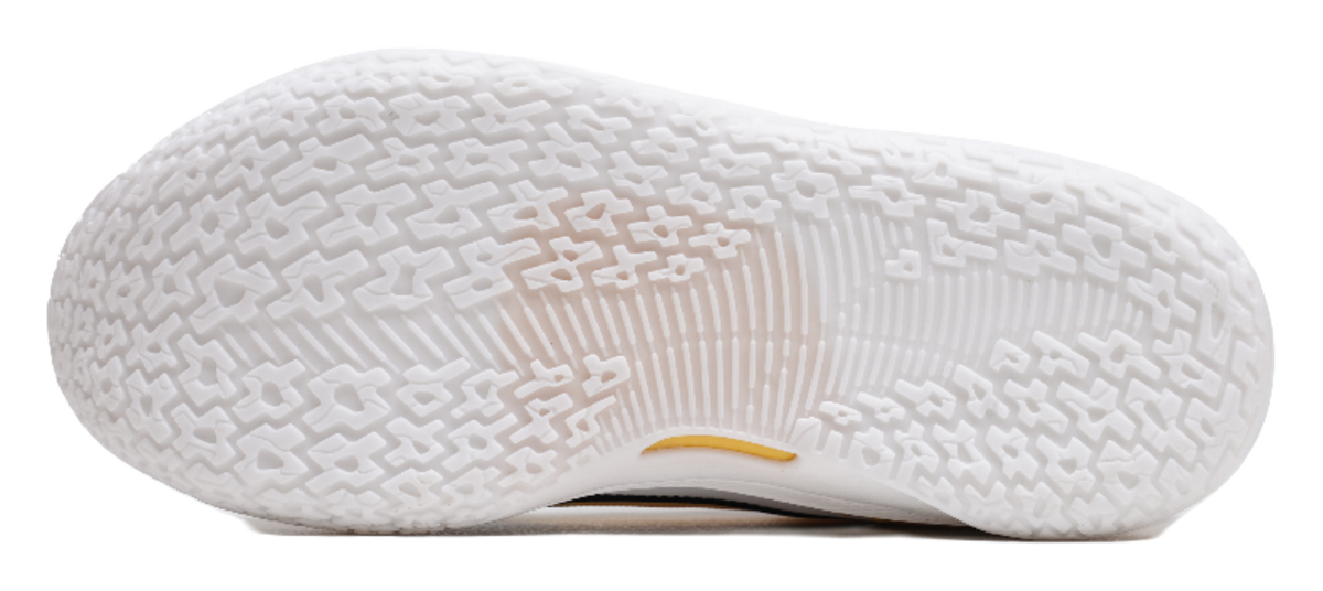 Basketball shoe outsole, textured white rubber tread with yellow accent