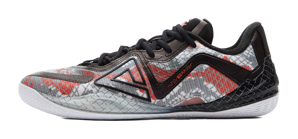 Black and red basketball shoe with speckled pattern and black laces