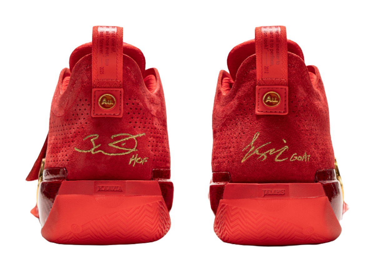 Red basketball shoes heel view with back tabs and printed heel label.