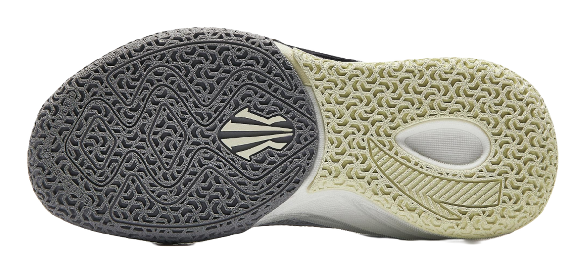 Basketball shoe outsole view: dark patterned forefoot and light traction rubber.
