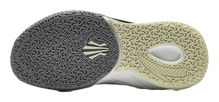 Basketball shoe outsole view: dark patterned forefoot and light traction rubber.