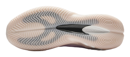 Basketball shoe outsole with textured traction tread on off-white rubber sole