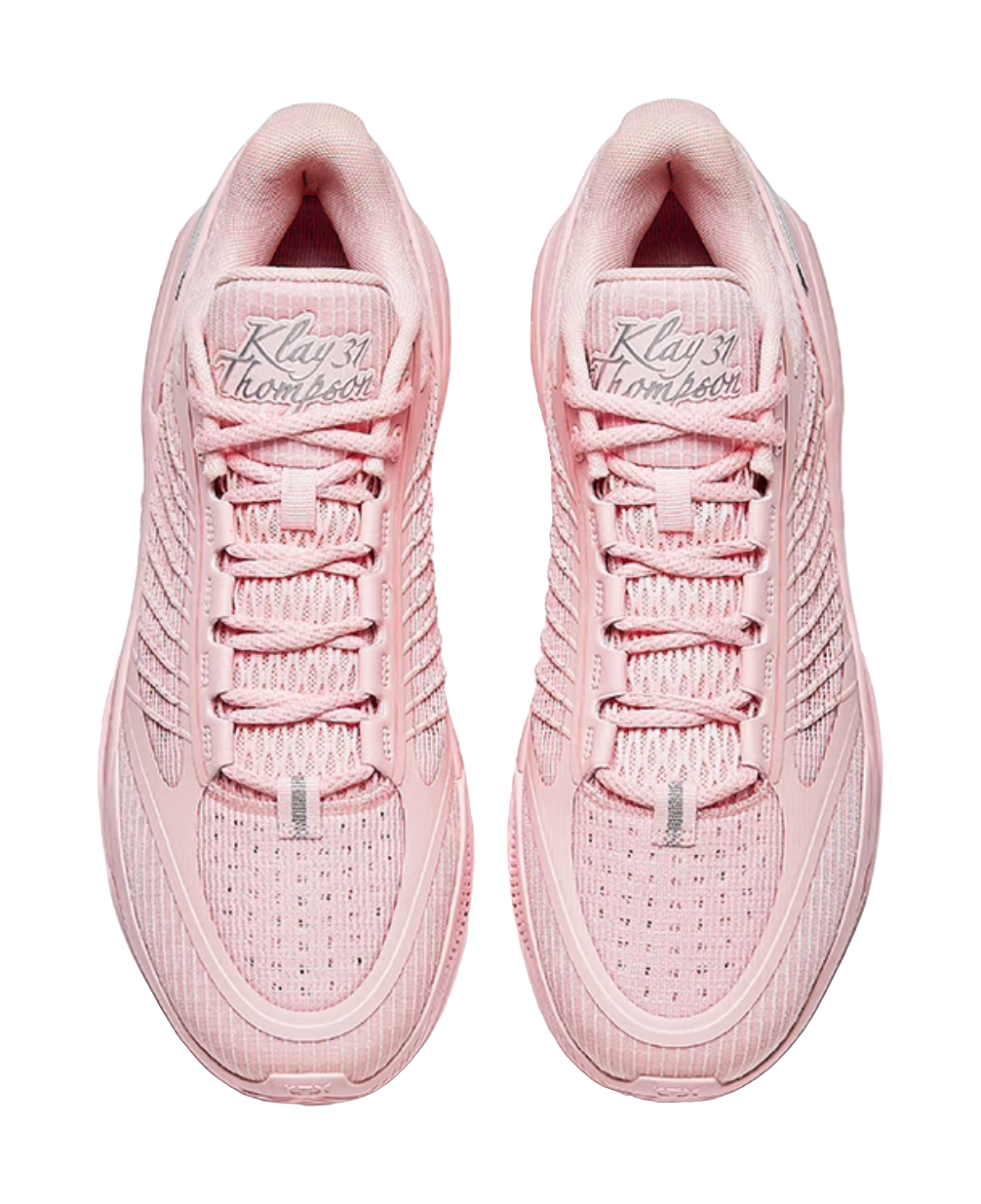 Pair of light pink sneakers showing lace-up tongue and embroidered inner logo