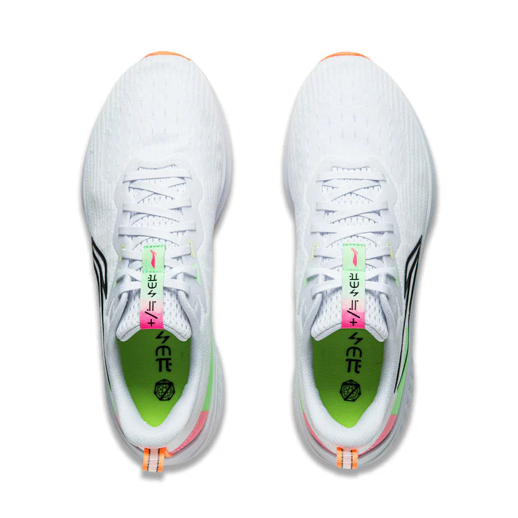 Pair of men's running shoes showing white laces and green insole panel
