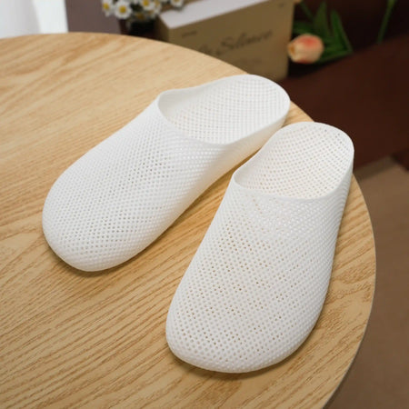 White 3D printed slip-on slippers with perforated textured upper