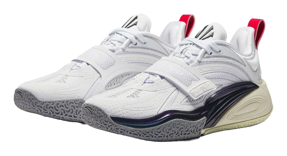 Pair of white basketball shoes with red heel accents and sculpted navy outsole trim.
