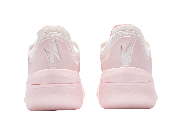 Light pink basketball shoe with heel tab and rear cushioning, lace-up