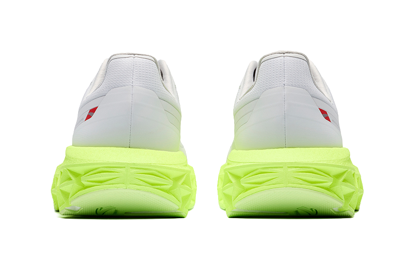 Mens low-top sneakers, rear view with light gray upper and neon green cushioning sole