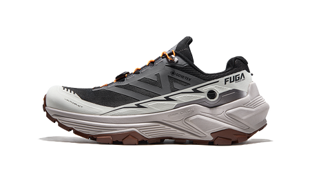 Gray and black trail running shoe with orange lace accents and thick tread sole, side view.