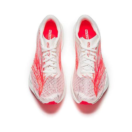 Women's running shoe pair, white mesh upper with red laces and red graphic detailing.
