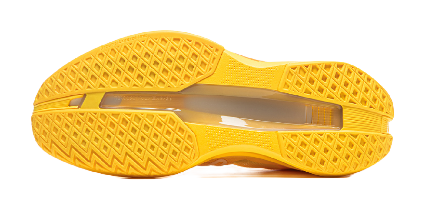 Yellow basketball shoe outsole tread with textured rubber grip