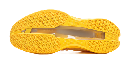 Yellow basketball shoe outsole tread with textured rubber grip