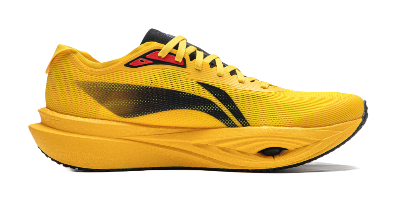 Chrome yellow low-top running shoe, side view, black graphic stripe and yellow laces.