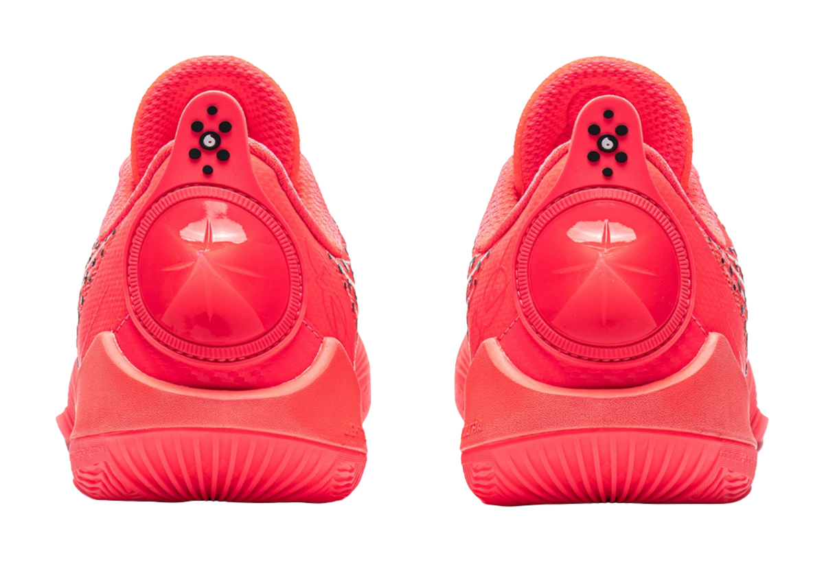 Fluorescent red basketball shoes, heel view with molded support and logo badge