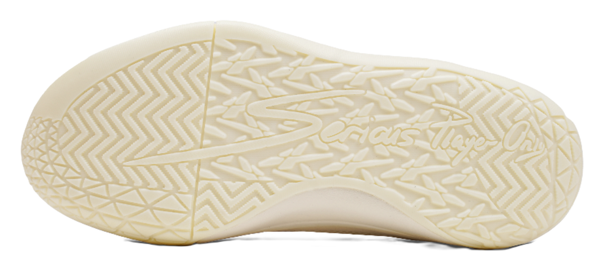 Cream rubber outsole with geometric traction tread pattern