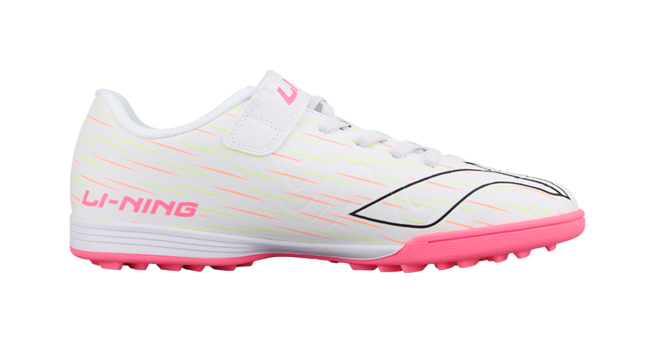 Youth turf soccer shoe in white with pink trim, Velcro strap and black logo