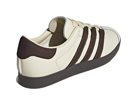 Unisex low-top skate shoes, cream leather heel with dark brown collar and stripes