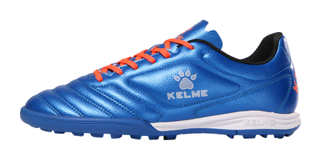 Kelme royal blue TF soccer shoe with orange laces, white midsole, paw logo