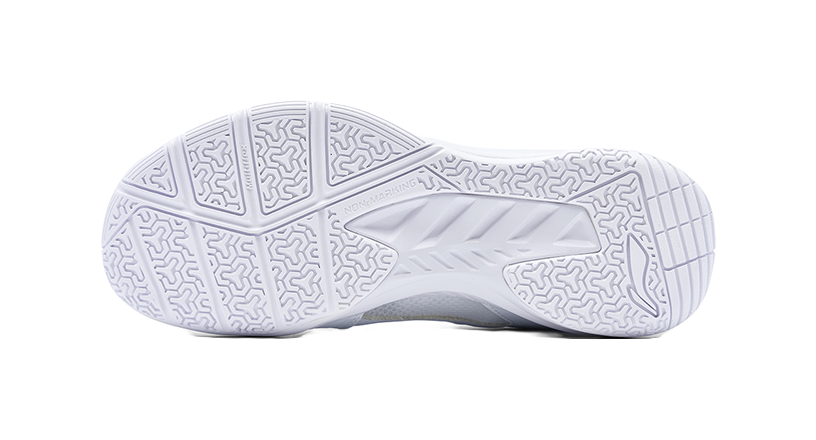 White badminton shoe outsole with geometric tread pattern