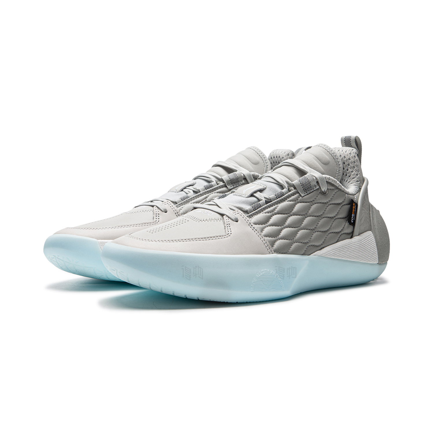 Men's grey basketball shoe angled front view with lace-up closure and light blue sole