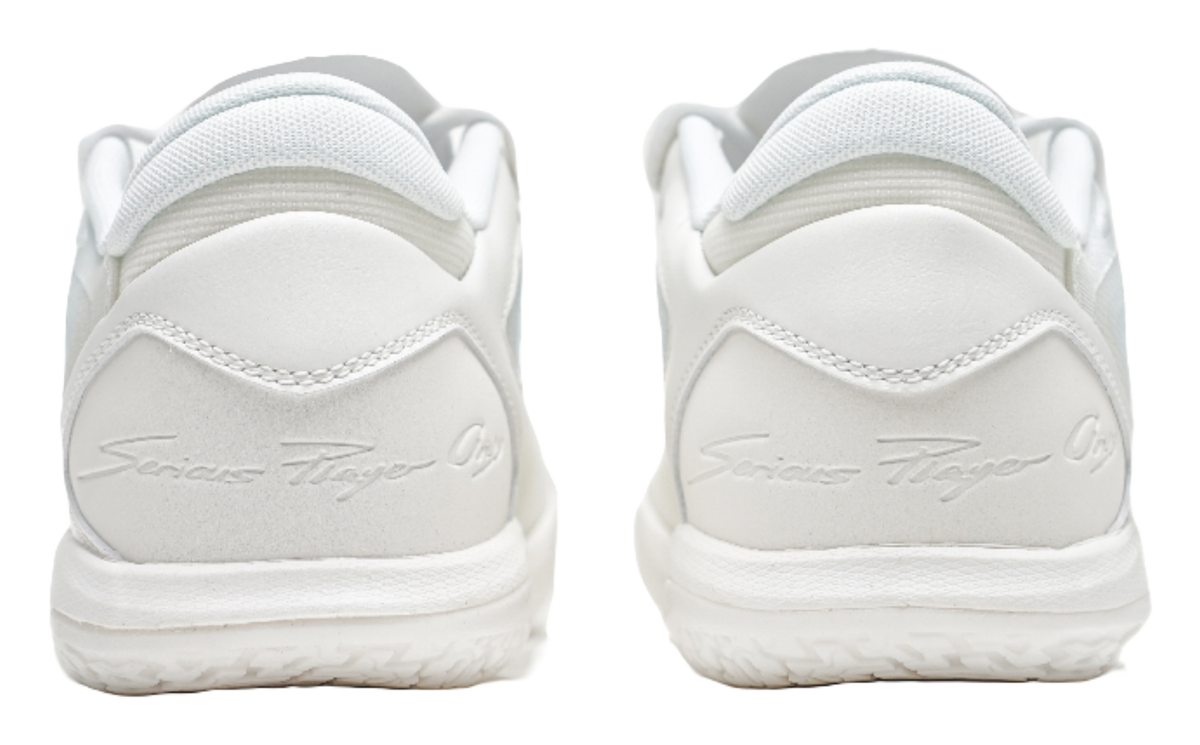 Pair of pure white low-top basketball shoes, rear view with cushioned heel