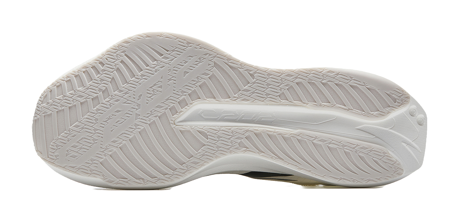 White running shoe outsole with textured tread pattern.