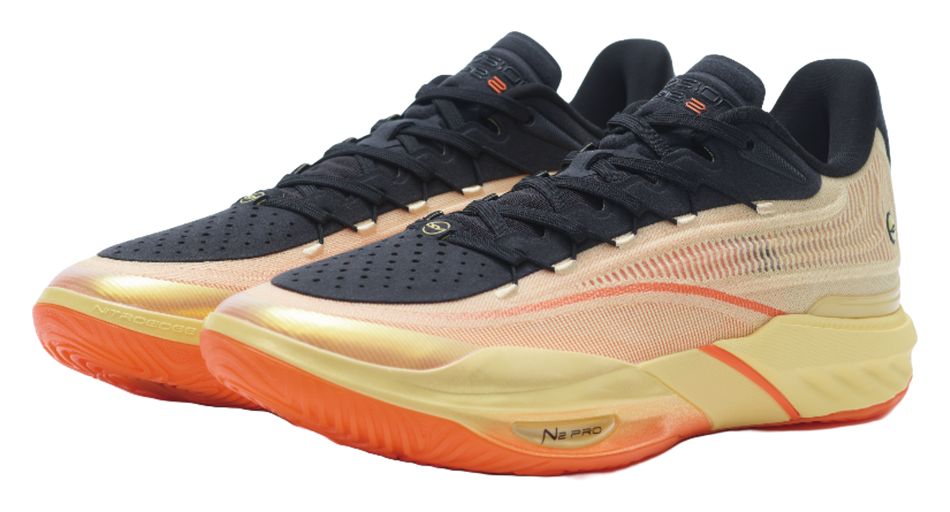 Pair of basketball shoes, black laces, beige knit upper with orange-red accents and yellow sole