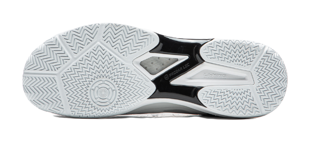 Outsole of white table tennis shoe with zigzag traction pattern