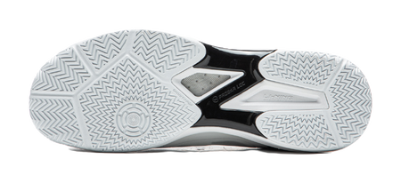 Outsole of white table tennis shoe with zigzag traction pattern