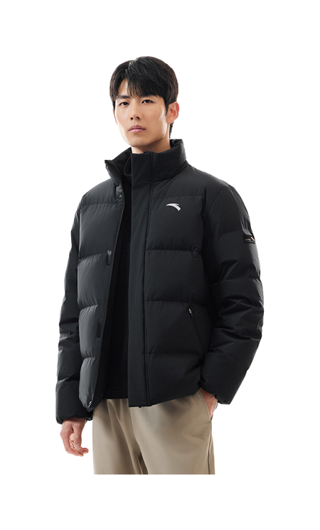 Men's black puffer down jacket on model, stand collar and zip front visible