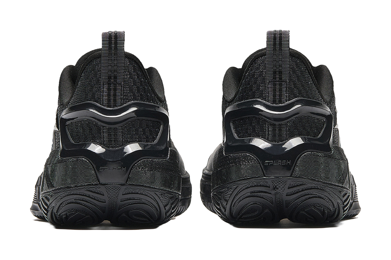 Low-top basketball sneakers, rear view showing black heel and thick molded outsole