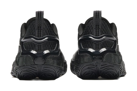 Low-top basketball sneakers, rear view showing black heel and thick molded outsole