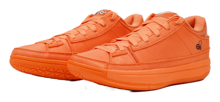 Orange lace-up basketball shoes with textured stripes on side