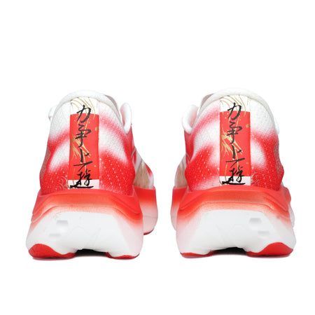 Women’s running shoes heel view with red/orange koi print and white cushioned sole