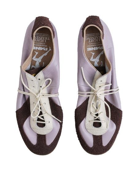 Lavender lace-up low-top shoes with white eyelets and dark brown heel lining, gum sole