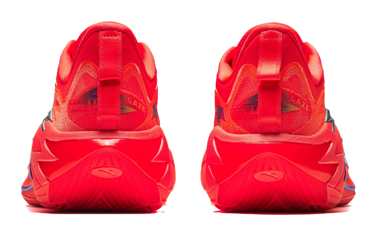 Pair of red basketball shoes, heel view, textured knit upper and molded tread sole